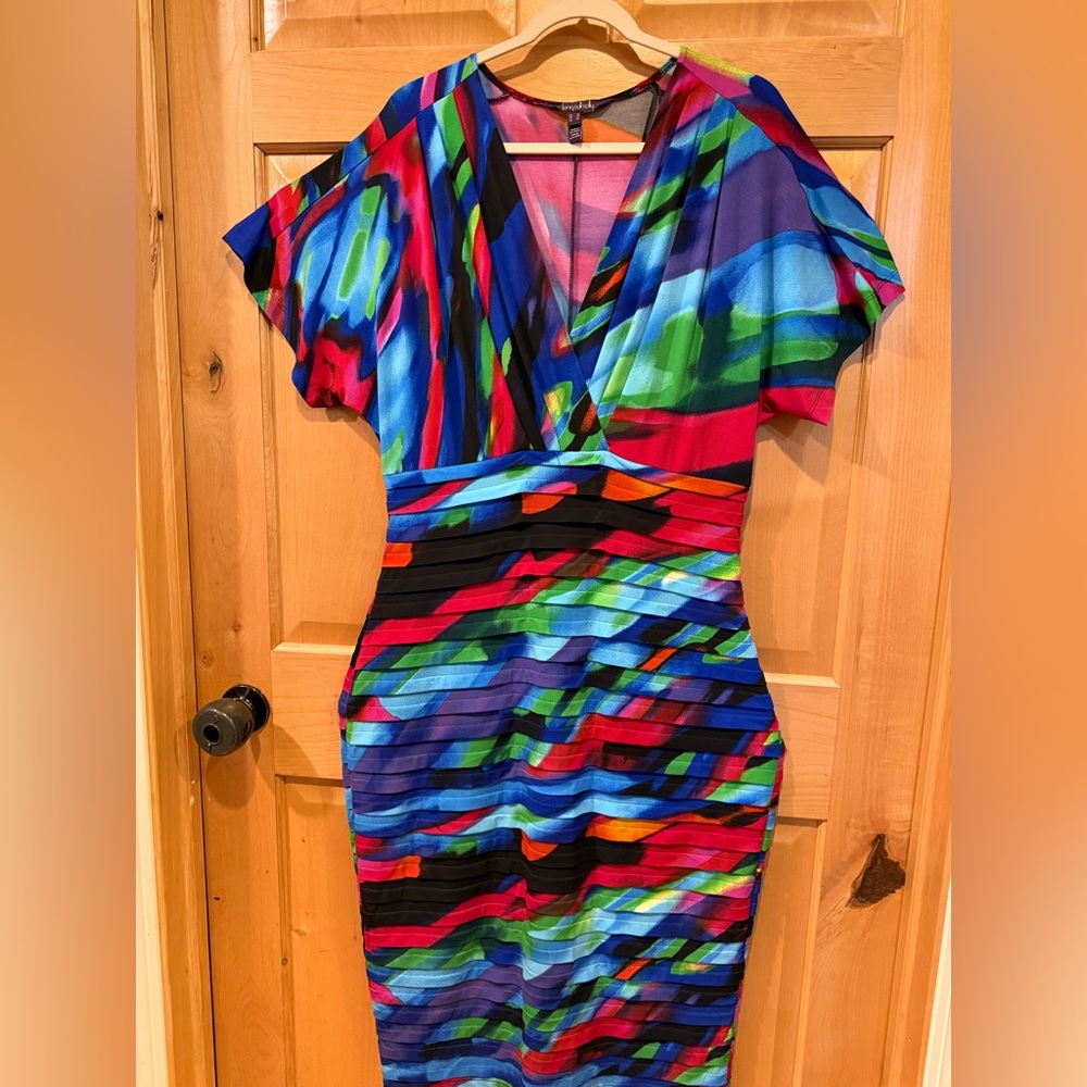 Worn 1x, US 14 knee length. Stretchy up to 18. Date night/wedding/cruise/resort.